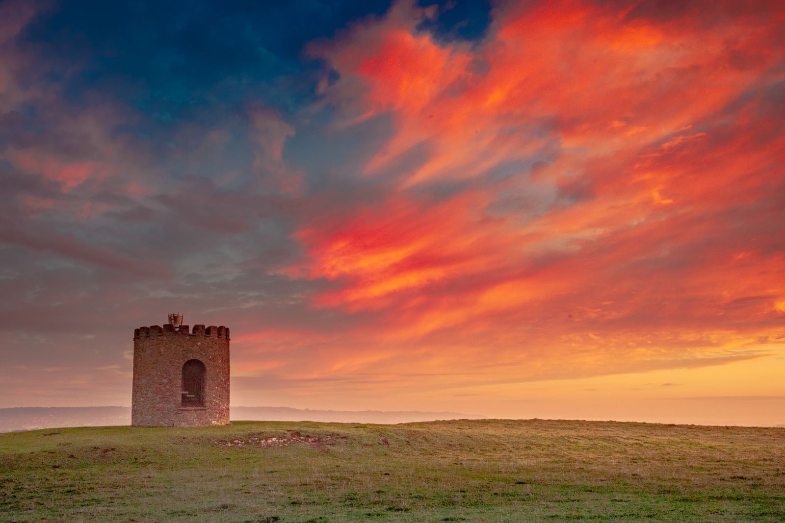 A spectacular sunrise over the Uphill viewing tower near Weston-super-Mare